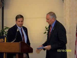 Joseph Butchko (l), chapter president, presents a $5,000 check to Donahoe on behalf of the chapter.